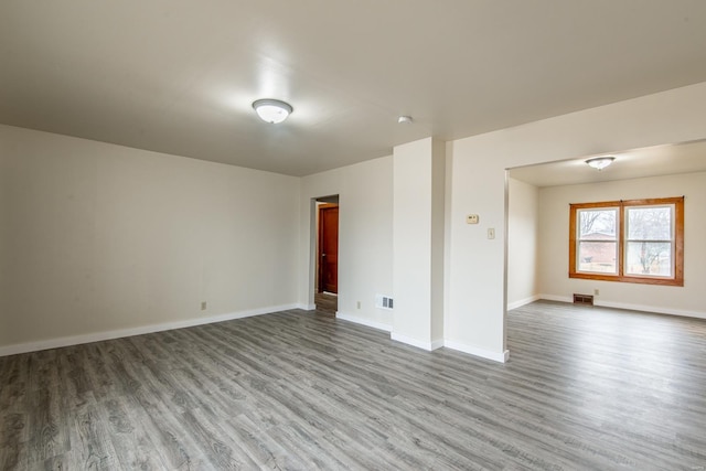 spare room with hardwood / wood-style floors