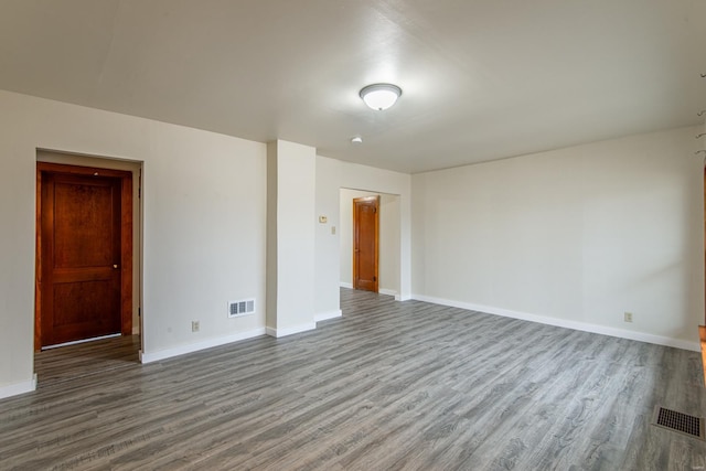 unfurnished room featuring hardwood / wood-style floors