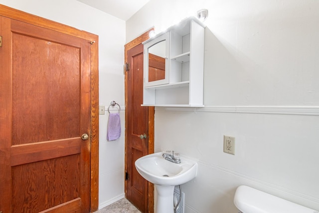 bathroom with sink and toilet