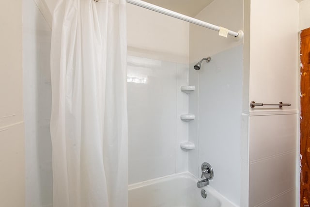 bathroom featuring shower / bath combo with shower curtain