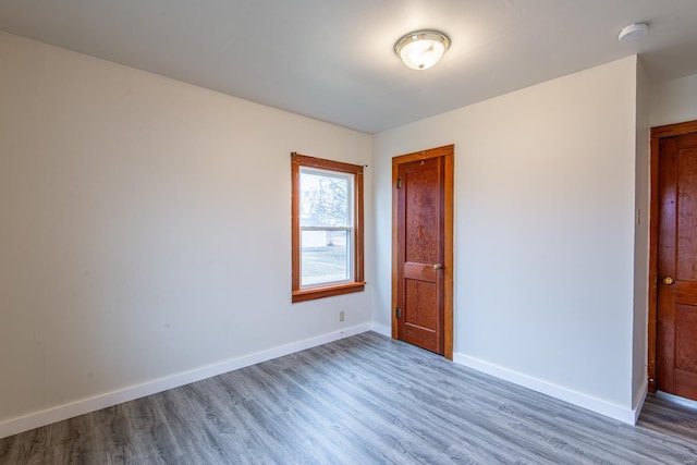 unfurnished room featuring hardwood / wood-style floors