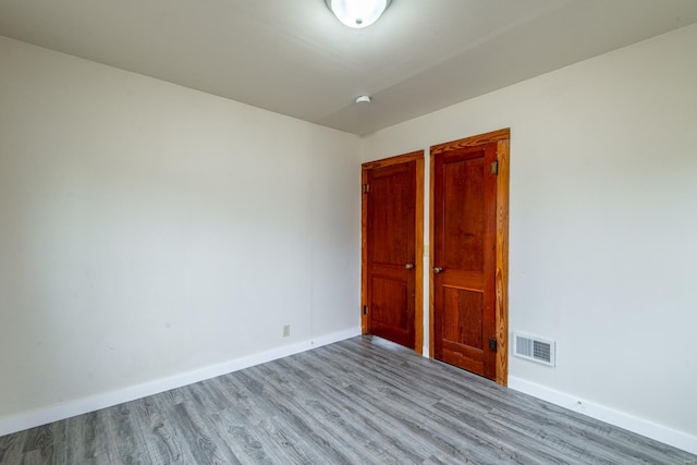 spare room featuring light wood-type flooring