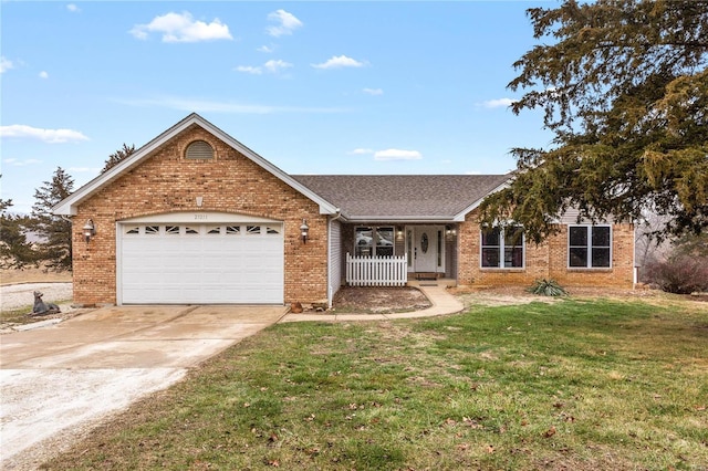 ranch-style house featuring a garage, a porch, and a front yard