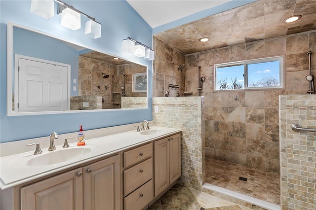 bathroom featuring vanity and a tile shower