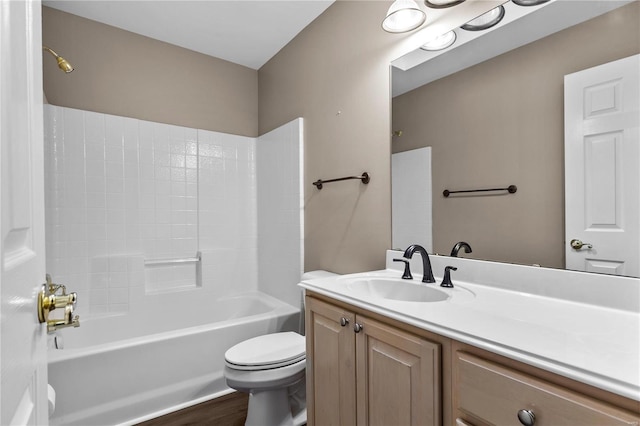 full bathroom with vanity, wood-type flooring, tub / shower combination, and toilet