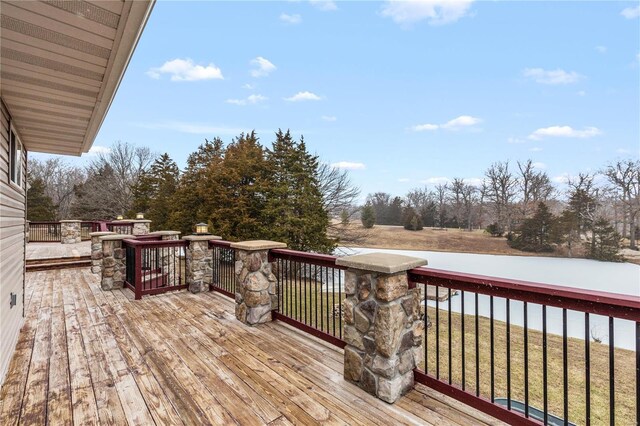 wooden terrace with a yard