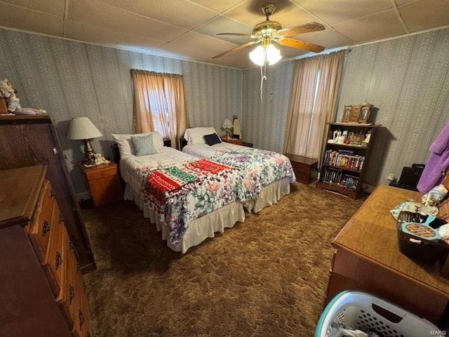 bedroom featuring dark carpet and ceiling fan