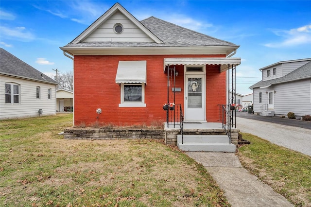 bungalow with a front lawn