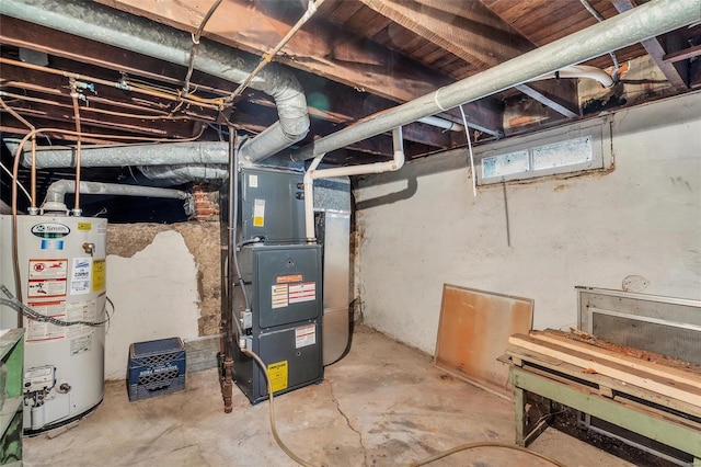 utility room featuring water heater and heating unit