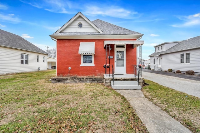 bungalow with a front yard