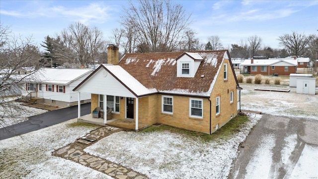 view of snow covered house