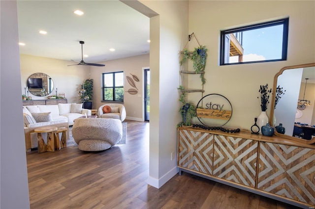 interior space featuring dark wood-type flooring and ceiling fan