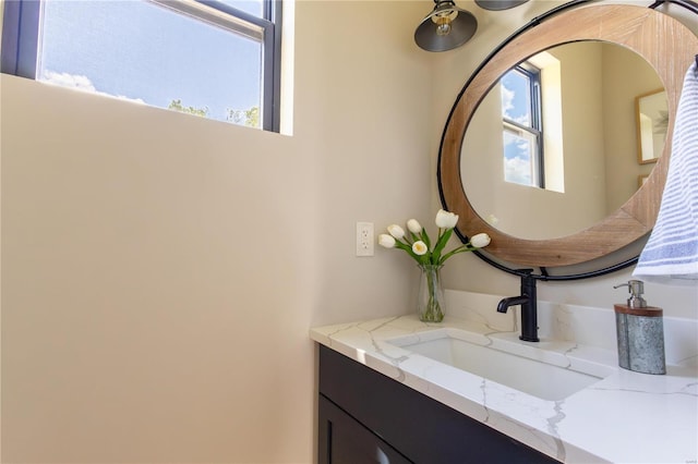 bathroom featuring vanity and a wealth of natural light