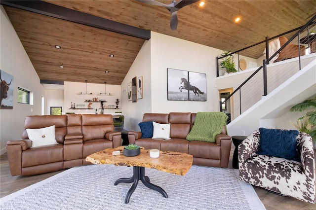 living room featuring wood ceiling, wood-type flooring, high vaulted ceiling, and ceiling fan