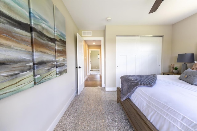 bedroom with ceiling fan and a closet