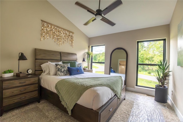 carpeted bedroom featuring vaulted ceiling and ceiling fan