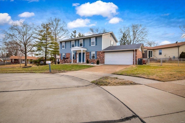 view of front of property with a garage and a front lawn