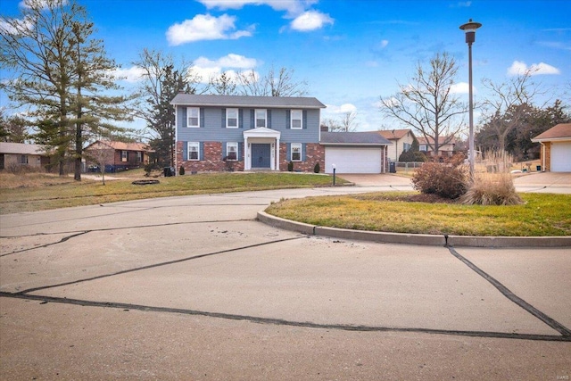 view of front of home featuring a garage and a front yard