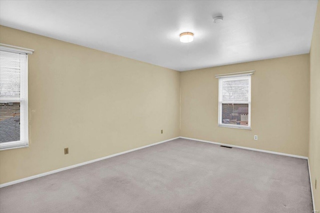 empty room with light colored carpet