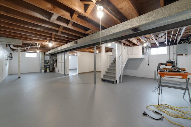 basement with a wealth of natural light and electric panel