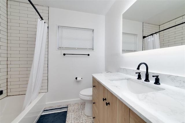 full bathroom with vanity, toilet, tile patterned flooring, and shower / bath combo with shower curtain