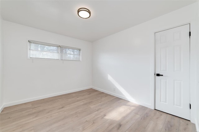 empty room with light wood-type flooring