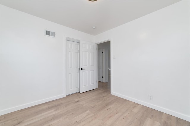 empty room with light wood-type flooring