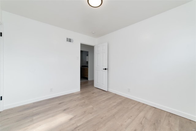 unfurnished room featuring light hardwood / wood-style flooring