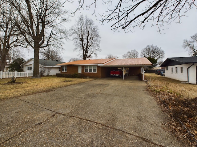 ranch-style home with a carport