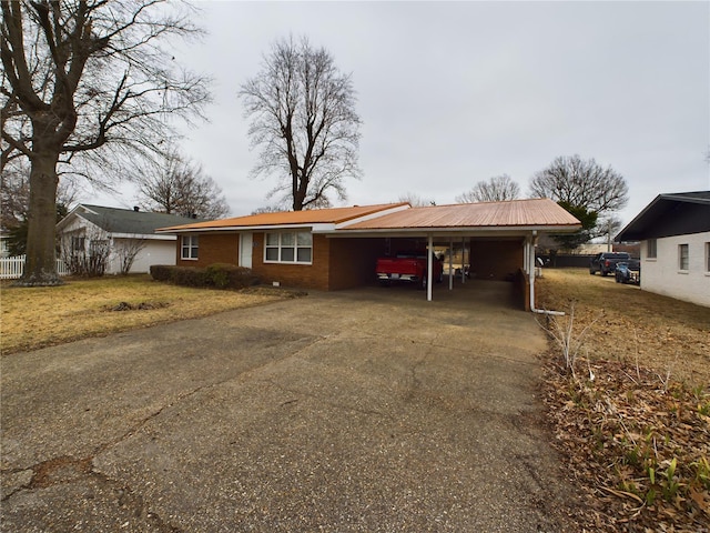 ranch-style house with a carport