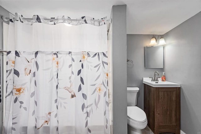 full bathroom with vanity, toilet, and shower / bath combo with shower curtain