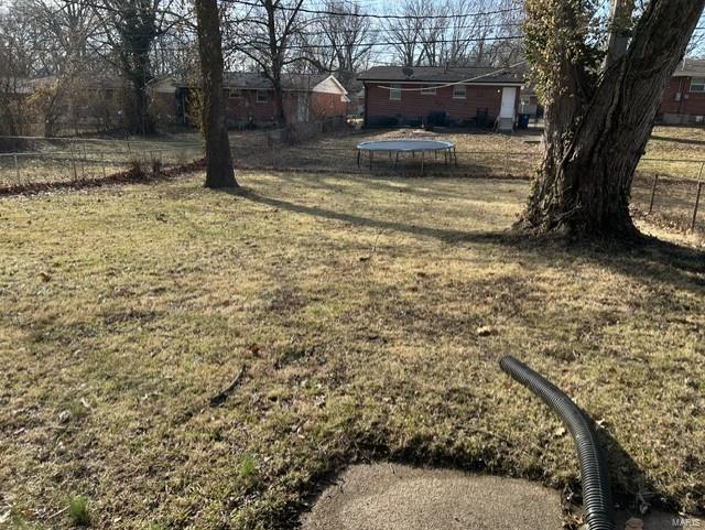 view of yard with a trampoline