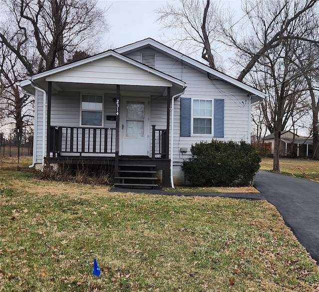 bungalow-style house with a front yard and a porch