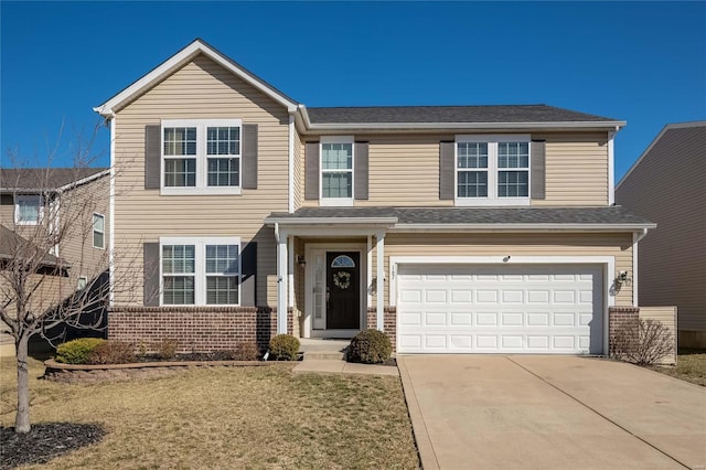 traditional-style home with an attached garage, roof with shingles, concrete driveway, and brick siding