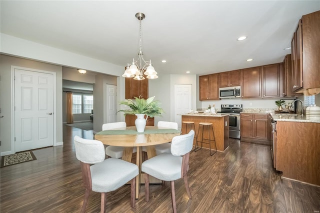 dining space with baseboards, a chandelier, dark wood-style flooring, and recessed lighting