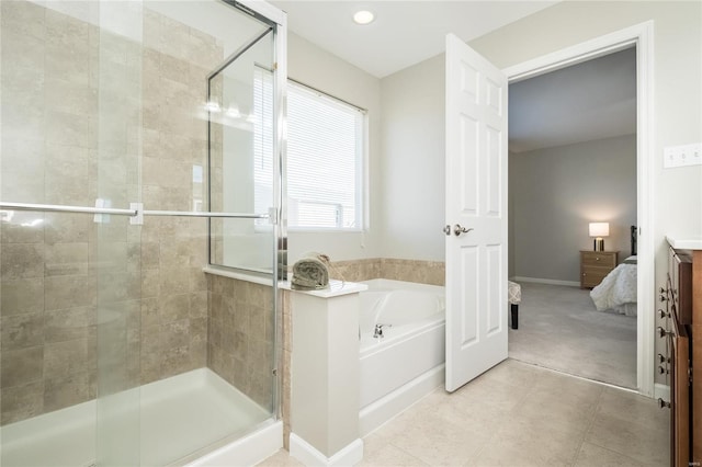 bathroom with a shower stall, connected bathroom, baseboards, and a bath