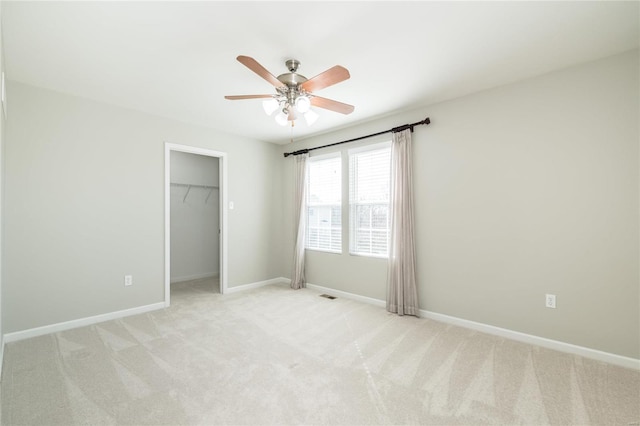 unfurnished bedroom featuring light carpet, visible vents, and baseboards