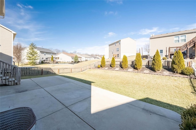 view of patio featuring a fenced backyard and a residential view