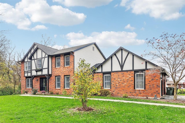 tudor house featuring a front lawn