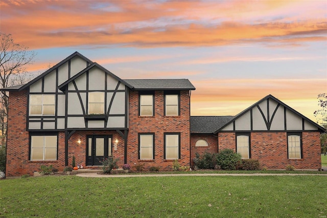 tudor house featuring a yard