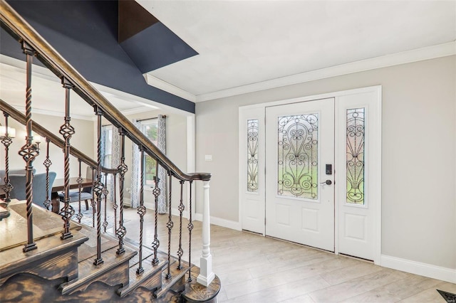 entryway with crown molding and light wood-type flooring