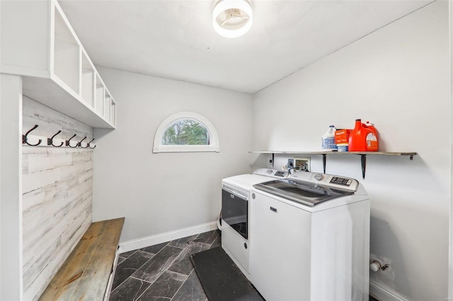 clothes washing area with washer and clothes dryer