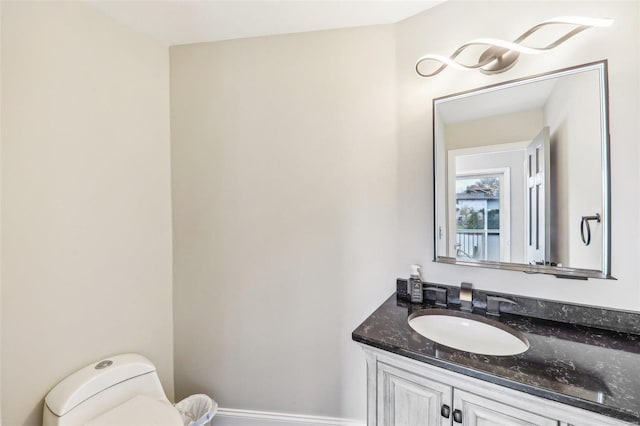 bathroom with vanity and toilet