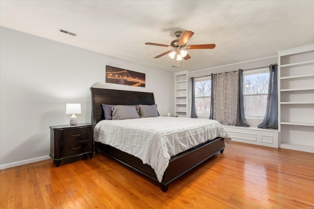 bedroom with light hardwood / wood-style flooring and ceiling fan