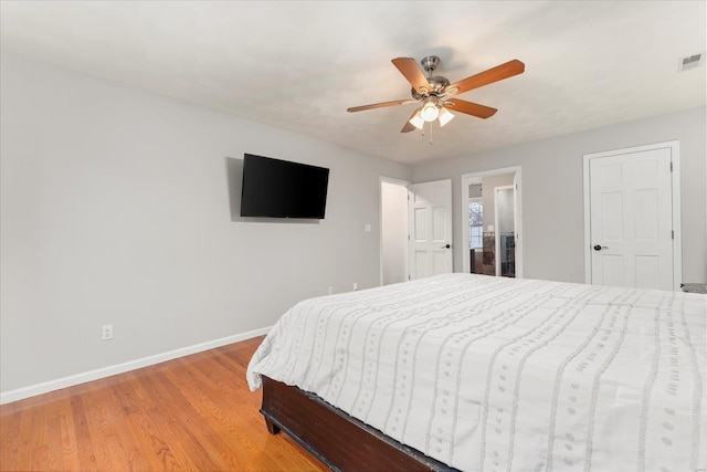 bedroom featuring ceiling fan and light hardwood / wood-style flooring