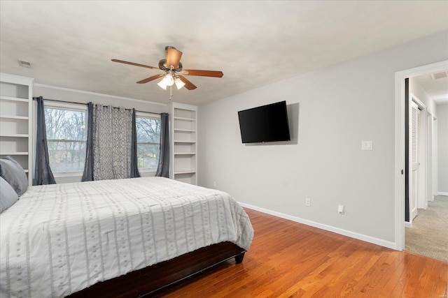 bedroom with hardwood / wood-style floors and ceiling fan