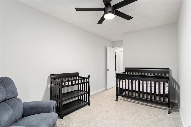 bedroom featuring light carpet and ceiling fan