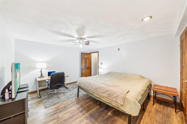 bedroom featuring hardwood / wood-style floors and ceiling fan