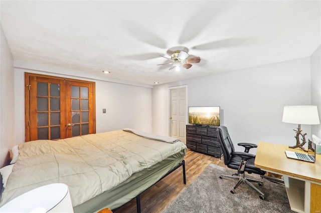 bedroom with wood-type flooring and ceiling fan