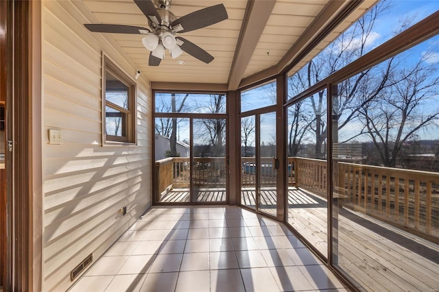 unfurnished sunroom with wood ceiling and ceiling fan